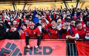 24 January 2023; CUS supporters celebrate after their side's victory in the Bank of Ireland Vinnie Murray Cup Semi-Final match between St Fintans High School and CUS at Energia Park in Dublin. Photo by Tyler Miller/Sportsfile