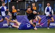 24 January 2023; Rhys Morgan of Temple Carrig is tackled by Conn Doherty of St Andrew's College during the Bank of Ireland Vinnie Murray Cup Semi-Final match between Temple Carrig and St Andrews College at Energia Park in Dublin. Photo by Tyler Miller/Sportsfile