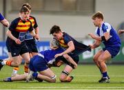 24 January 2023; Nathan Ross of Temple Carrig is tackled by James O'Donoghue, left, and Rocco Hill of St Andrew's College during the Bank of Ireland Vinnie Murray Cup Semi-Final match between Temple Carrig and St Andrews College at Energia Park in Dublin. Photo by Tyler Miller/Sportsfile