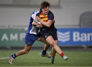 24 January 2023; Rhys Gambie of Temple Carrig is tackled by Kiran Byrne of St Andrew's College during the Bank of Ireland Vinnie Murray Cup Semi-Final match between Temple Carrig and St Andrews College at Energia Park in Dublin. Photo by Tyler Miller/Sportsfile