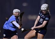 24 January 2023; Carlise Comerford of SETU Waterford in action against Aoife Whelan of UCD during the Ashbourne Cup Round 2 match between UCD and South East Technological University Waterford at Billings Park, UCD in Dublin. Photo by Sam Barnes/Sportsfile