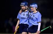24 January 2023; UCD players Andrea Scully, left, and Cliodhna Nicoletti leave the field dejected after their defeat in the Ashbourne Cup Round 2 match between UCD and South East Technological University Waterford at Billings Park, UCD in Dublin. Photo by Sam Barnes/Sportsfile