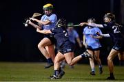 24 January 2023; Caoimhe Collins of UCD in action against Molly O'Connor, left, and Caoimhe McCormack of SETU Waterford during the Ashbourne Cup Round 2 match between UCD and South East Technological University Waterford at Billings Park, UCD in Dublin. Photo by Sam Barnes/Sportsfile