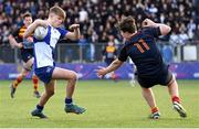 24 January 2023; Harry Machesney of St Andrew's College evades the tackle of Rhys Gambie of Temple Carrig during the Bank of Ireland Vinnie Murray Cup Semi-Final match between Temple Carrig and St Andrews College at Energia Park in Dublin. Photo by Tyler Miller/Sportsfile