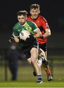 25 January 2023; Padraig Purcell of Queen's University Belfast in action against Damien Bourke of UCC during the HE GAA Sigerson Cup Round 3 match between University College Cork and Queen's University Belfast at the GAA National Games Development Centre in Abbotstown, Dublin. Photo by Piaras Ó Mídheach/Sportsfile