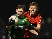 25 January 2023; Padraig Purcell of Queen's University Belfast in action against Damien Bourke of UCC during the HE GAA Sigerson Cup Round 3 match between University College Cork and Queen's University Belfast at the GAA National Games Development Centre in Abbotstown, Dublin. Photo by Piaras Ó Mídheach/Sportsfile