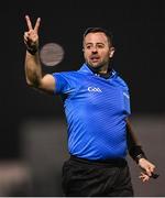 25 January 2023; Referee David Gough indicates that a player bounced the ball twice during the HE GAA Sigerson Cup Round 3 match between University College Cork and Queen's University Belfast at the GAA National Games Development Centre in Abbotstown, Dublin. Photo by Piaras Ó Mídheach/Sportsfile