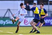 26 January 2023; Joseph Byrne of Presentation College Bray kicks past Charlie Croke of CBS Naas during the Bank of Ireland Fr Godfrey Cup Semi-Final match between CBS Naas and Presentation College Bray at Energia Park in Dublin. Photo by Ben McShane/Sportsfile