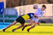 26 January 2023; Joseph Byrne of Presentation College Bray is tackled by Padraic Dignam of CBS Naas during the Bank of Ireland Fr Godfrey Cup Semi-Final match between CBS Naas and Presentation College Bray at Energia Park in Dublin. Photo by Ben McShane/Sportsfile