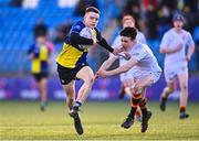 26 January 2023; Charlie Croke of CBS Naas holds off the tackle of Joseph Byrne of Presentation College Bray on his way to scoring a try during the Bank of Ireland Fr Godfrey Cup Semi-Final match between CBS Naas and Presentation College Bray at Energia Park in Dublin. Photo by Ben McShane/Sportsfile