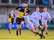 26 January 2023; Darragh Culligan of CBS Naas is tackled by Simon O'Brien of Presentation College Bray during the Bank of Ireland Fr Godfrey Cup Semi-Final match between CBS Naas and Presentation College Bray at Energia Park in Dublin. Photo by Ben McShane/Sportsfile