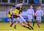 26 January 2023; Darragh Culligan of CBS Naas is tackled by Simon O'Brien of Presentation College Bray during the Bank of Ireland Fr Godfrey Cup Semi-Final match between CBS Naas and Presentation College Bray at Energia Park in Dublin. Photo by Ben McShane/Sportsfile