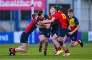 26 January 2023; Fionn Heaney of St Fintans High School is tackled by Fionn Moriarty, left, and Charles Lambert of Temple Carrig during the Bank of Ireland Fr Godfrey Cup Semi-Final match between St Fintans High School and Temple Carrig at Energia Park in Dublin. Photo by Ben McShane/Sportsfile