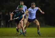 26 January 2023; Luke Hogan of Maynooth University in action against Colum Prendiville of UCD during the HE GAA Fitzgibbon Cup Round 2 match between Maynooth University and University College Dublin at the Maynooth University North Campus in Kildare. Photo by Tyler Miller/Sportsfile