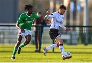 27 January 2023; Archie Davies of Dundalk in action against Franco Umeh of Cork City during the Pre-Season Friendly match between Cork City and Dundalk at the FAI National Training Centre in Abbotstown, Dublin. Photo by Ben McShane/Sportsfile