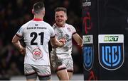 27 January 2023; Mike Lowry of Ulster celebrates with teammate John Cooney, 21, after scoring their side's fifth try during the United Rugby Championship match between Ulster and DHL Stormers at Kingspan Stadium in Belfast. Photo by Ramsey Cardy/Sportsfile