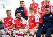 27 January 2023; Players and staff, including Jake Mulraney, second from left, wait for their squad photograph to be taken during a St Patrick's Athletic squad portrait session at Richmond Park in Dublin. Photo by Stephen McCarthy/Sportsfile