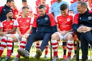 27 January 2023; Players and staff, from left, Jake Mulraney, Jamie Lennon, manager Tim Clancy, Joe Redmond and technical director Alan Mathews wait for their squad photograph to be taken during a St Patrick's Athletic squad portrait session at Richmond Park in Dublin. Photo by Stephen McCarthy/Sportsfile