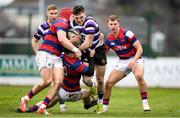 28 January 2023; Ciraig Adams of Terenure College is tackled by Tadhg Bird and Michael Courtney of Clontarf during the Energia All-Ireland League Division 1A match between Terenure College and Clontarf at Lakelands Park in Dublin. Photo by Matt Browne/Sportsfile