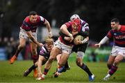 28 January 2023; Michael Courtney of Clontarf is tackled by Callum Smith and Colm de Buitlear of Terenure College during the Energia All-Ireland League Division 1A match between Terenure College and Clontarf at Lakelands Park in Dublin. Photo by Matt Browne/Sportsfile