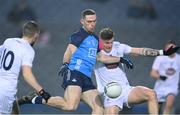 28 January 2023; Brian Fenton of Dublin on his way to scoring his side's first goal despite the attention of Kevin O’Callaghan of Kildare during the Allianz Football League Division 2 match between Dublin and Kildare at Croke Park in Dublin. Photo by Stephen McCarthy/Sportsfile
