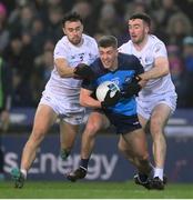 28 January 2023; Greg McEneaney of Dublin in action against Darragh Malone, left, and Kevin Flynn of Kildare during the Allianz Football League Division 2 match between Dublin and Kildare at Croke Park in Dublin. Photo by Stephen McCarthy/Sportsfile