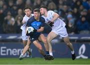 28 January 2023; Greg McEneaney of Dublin in action against Darragh Malone, left, and Kevin Flynn of Kildare during the Allianz Football League Division 2 match between Dublin and Kildare at Croke Park in Dublin. Photo by Stephen McCarthy/Sportsfile