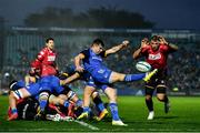 28 January 2023; Luke McGrath of Leinster kicks clear from Josh Turnbull of Cardiff during the United Rugby Championship match between Leinster and Cardiff at RDS Arena in Dublin. Photo by Ben McShane/Sportsfile