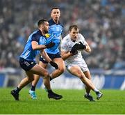 28 January 2023; Darragh Kirwan of Kildare in action against Cormac Costello and Seán McMahon of Dublin during the Allianz Football League Division 2 match between Dublin and Kildare at Croke Park in Dublin. Photo by Stephen Marken/Sportsfile