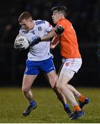28 January 2023; Kieran Duffy of Monaghan is tackled by Andrew Murnin of Armagh during the Allianz Football League Division 1 match between Monaghan and Armagh at St Mary's Park in Castleblayney, Monaghan. Photo by Ramsey Cardy/Sportsfile