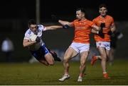 28 January 2023; Shane Carey of Monaghan is tackled by Ross Finn of Armagh during the Allianz Football League Division 1 match between Monaghan and Armagh at St Mary's Park in Castleblayney, Monaghan. Photo by Ramsey Cardy/Sportsfile