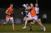 28 January 2023; Shane Carey of Monaghan is tackled by Ross Finn of Armagh during the Allianz Football League Division 1 match between Monaghan and Armagh at St Mary's Park in Castleblayney, Monaghan. Photo by Ramsey Cardy/Sportsfile