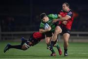 28 January 2023; Tom Farrell of Connacht is tackled by Darrien Landsberg, left, and JP Smith of Emirates Lions during the United Rugby Championship match between Connacht and Emirates Lions at The Sportsground in Galway. Photo by Seb Daly/Sportsfile