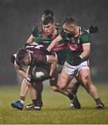 28 January 2023; Johnny Heaney of Galway in action against Mayo players, from left, Jordan Flynn, Diarmuid O’Connor and Ryan O'Donoghue during the Allianz Football League Division 1 match between Mayo and Galway at Hastings Insurance MacHale Park in Castlebar, Mayo. Photo by Piaras Ó Mídheach/Sportsfile