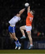 28 January 2023; Aidan Nugent of Armagh in action against Joel Wilson of Monaghan during the Allianz Football League Division 1 match between Monaghan and Armagh at St Mary's Park in Castleblayney, Monaghan. Photo by Ramsey Cardy/Sportsfile