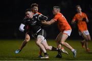 28 January 2023; Monaghan goalkeeper Rory Beggan is tackled by Jason Duffy, left, and Aidan Nugent of Armagh during the Allianz Football League Division 1 match between Monaghan and Armagh at St Mary's Park in Castleblayney, Monaghan. Photo by Ramsey Cardy/Sportsfile