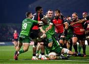 28 January 2023; Emmanuel Tshituka of Emirates Lions is tackled by Caolin Blade, left, and Niall Murphy of Connacht during the United Rugby Championship match between Connacht and Emirates Lions at The Sportsground in Galway. Photo by Seb Daly/Sportsfile