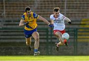 29 January 2023; Darragh Canavan of Tyrone in action against Ciarán Lennon of Roscommon during the Allianz Football League Division 1 match between Roscommon and Tyrone at Dr Hyde Park in Roscommon. Photo by Seb Daly/Sportsfile
