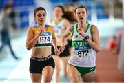 29 January 2023; Ellie Hartnett of U.C.D. AC, Dublin, left, and Niamh Kearney of Raheny Shamrock AC, Dublin, competing in the Women's Senior 1500m during the 123.ie AAI Indoor Games at the TUS International arena in Athlone, Westmeath. Photo by Ben McShane/Sportsfile
