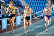 29 January 2023; Athletes, from left, Cliodhna Manning of Kilkenny City Harriers AC, Kilkenny,Lucy-May Sleeman of Leevale AC, Cork, and Sarah Mc Carthy of Mid Sutton AC, Dublin, competing in the Women's Senior 200m during the 123.ie AAI Indoor Games at the TUS International arena in Athlone, Westmeath. Photo by Ben McShane/Sportsfile