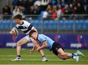 29 January 2023; Jack Dunne of Belvedere College is tackled by James Sherwin of St Michael's College during the Bank of Ireland Leinster Rugby Schools Senior Cup First Round match between St Michael’s College and Belvedere College at Energia Park in Dublin. Photo by Harry Murphy/Sportsfile