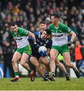 29 January 2023; Donal O'Sullivan of Kerry is tackled by Caolan McColgan, left, and Jason McGee of Donegal during the Allianz Football League Division 1 match between Donegal and Kerry at MacCumhaill Park in Ballybofey, Donegal. Photo by Ramsey Cardy/Sportsfile