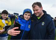 29 January 2023; Roscommon manager Davy Burke poses for a photograph with a supporter after their side's victory in the Allianz Football League Division 1 match between Roscommon and Tyrone at Dr Hyde Park in Roscommon. Photo by Seb Daly/Sportsfile