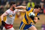 29 January 2023; Tadhg O’Rourke of Roscommon in action against Cormac Munroe of Tyrone during the Allianz Football League Division 1 match between Roscommon and Tyrone at Dr Hyde Park in Roscommon. Photo by Seb Daly/Sportsfile