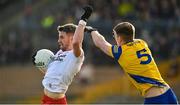 29 January 2023; Mattie Donnelly of Tyrone in action against Dylan Ruane of Roscommon during the Allianz Football League Division 1 match between Roscommon and Tyrone at Dr Hyde Park in Roscommon. Photo by Seb Daly/Sportsfile
