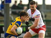 29 January 2023; Ben O’Carroll of Roscommon in action against Padraig Hampsey of Tyrone during the Allianz Football League Division 1 match between Roscommon and Tyrone at Dr Hyde Park in Roscommon. Photo by Seb Daly/Sportsfile