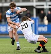 30 January 2023; James O'Sullivan of Blackrock College is tackled by Conor Bourke of Presentation College Bray during the Bank of Ireland Leinster Rugby Schools Senior Cup First Round match between Blackrock College and Presentation College Bray at Energia Park in Dublin. Photo by Ramsey Cardy/Sportsfile