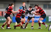 31 January 2023; Ronan McGroary of Newbridge College is tackled by George Wakeham, left, and Jake O'Sullivan of Kilkenny College during the Bank of Ireland Leinster Rugby Schools Senior Cup First Round match between Newbridge College and Kilkenny College at Energia Park in Dublin. Photo by Ben McShane/Sportsfile