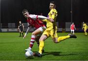 31 January 2023; Aaron Robinson of Wexford FC in action against Evan Harte of St Patrick's Athletic during the Leinster Senior Cup fourth round match between Patrick's Athletic and Wexford at Richmond Park in Dublin. Photo by David Fitzgerald/Sportsfile