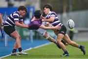 1 February 2023; Dermot Collins of Clongowes Wood College is tackled by Keith Byrne, left, and Thomas Costello of Terenure College during the Bank of Ireland Leinster Rugby Schools Senior Cup First Round match between Terenure College and Clongowes Wood College at Energia Park in Dublin. Photo by Ben McShane/Sportsfile